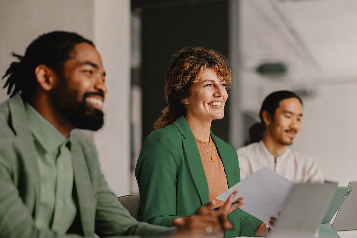 Four executives in a meeting.